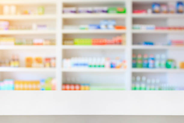 istock pharmacy counter with blur medicines shelves 840692794
