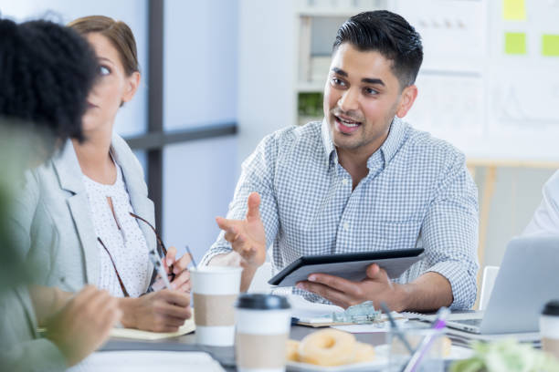 istock Business man explains something during meeting 840697802