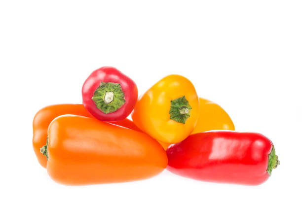 pile of mini bell peppers paprika isolated on white background. - pepper vegetable bell pepper red bell pepper imagens e fotografias de stock