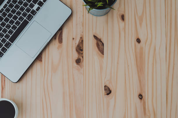istock Laptop and coffee cup on wood table with copy-space. 840703222