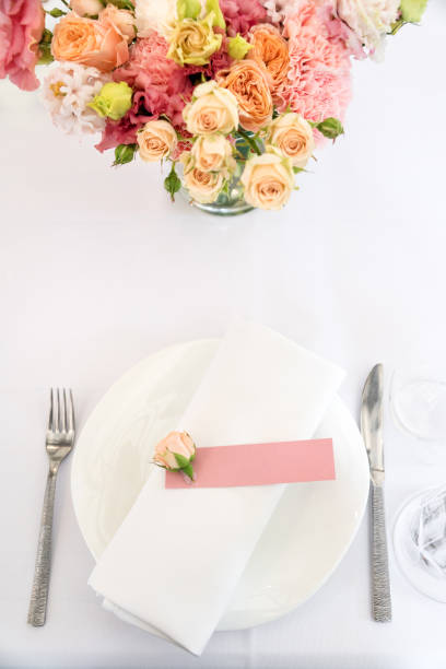 istock Flower table decorations for holidays and wedding dinner. Table set for holiday, event, party or wedding reception in outdoor restaurant. 840703748