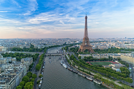 Eiffel tower at sunrise viewed from Jardins du Trocadero in Paris, France. Famous landmark and popular travel destination.