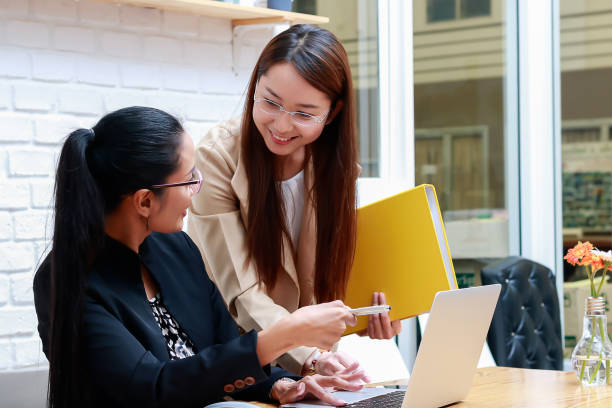 istock Two business women are discussing work. 840715584