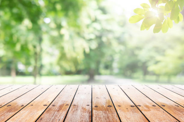 istock Empty wooden table with party in garden background blurred. 840715864