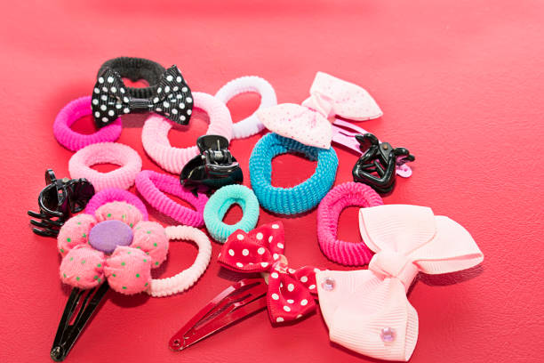Colorful hair clips close up with bow tie shape at souvenir store. Beauty accessories concept