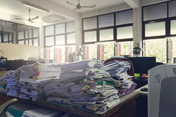 Concept of document workload, Pile of unfinished documents on office desk, Stack of business paper, Vintage effect