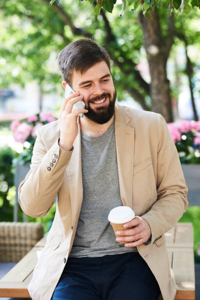 istock Modern Man Enjoying Phone Conversation Outdoors 840729772