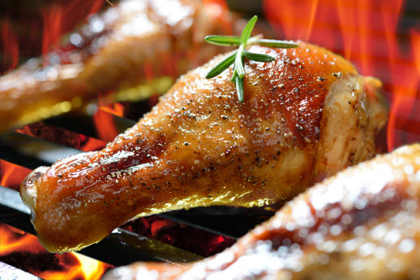 istock Grilled chicken leg on the flaming grill 840730148