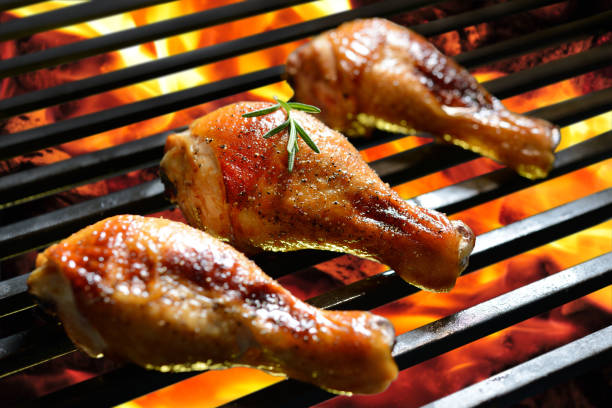 istock Grilled chicken leg on the flaming grill 840730182