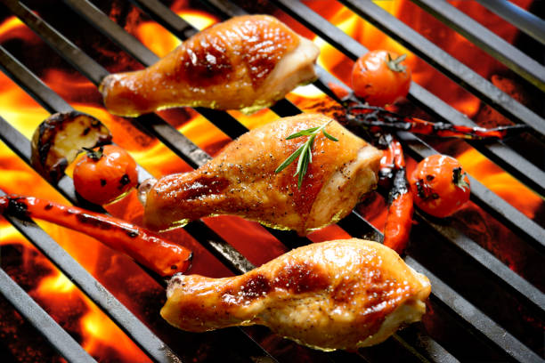istock Grilled chicken leg on the flaming grill 840730222