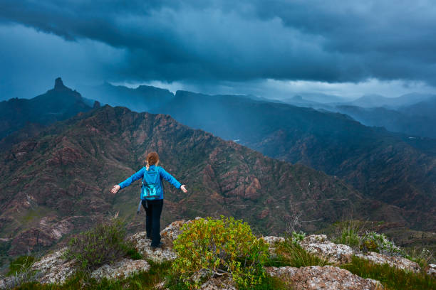 hiker woman on top of Grand Canary mountains enjoying the amazing feeling.