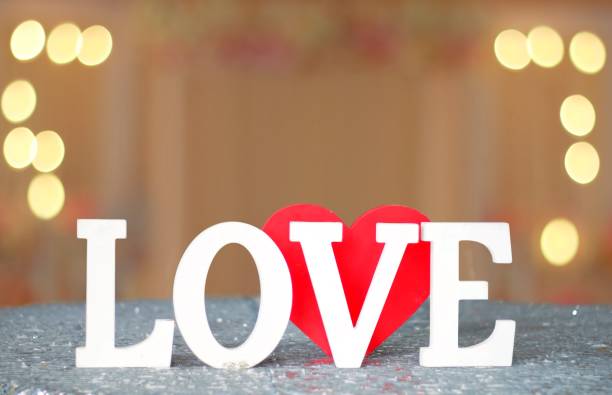 istock Love letters sign with blur lights 840734174