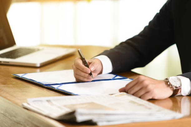 istock business man signing contract document in office 840734786
