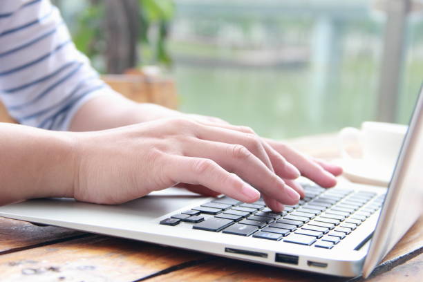 istock Female hand typing with laptop 840738026