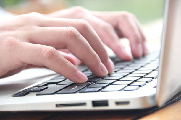 istock Female hand typing with laptop 840738204