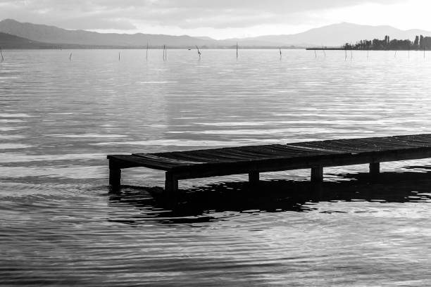 istock A pier on a lake at sunset, with beautiful, soft tones 840746092