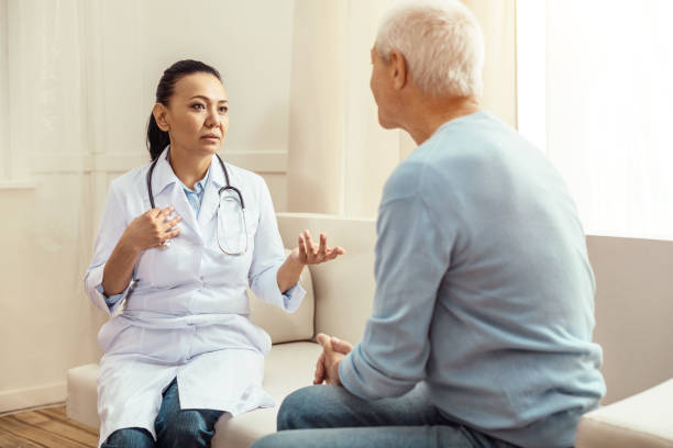 istock Nice professional doctor looking at her patient 840751618