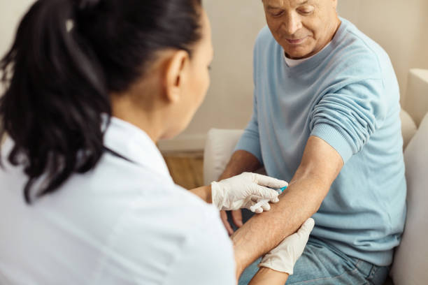 istock Professional female doctor doing an intravenous injection 840757814