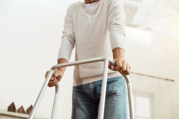 Professional walker helping the old man Useful equipment. Close up of a professional walking frame being used by a nice old man for walking aids walk stock pictures, royalty-free photos & images
