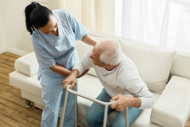 istock Pleasant friendly caregiver doing her job 840758762