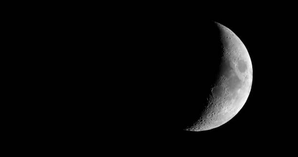 istock Waxing crescent moon seen with telescope 840767632