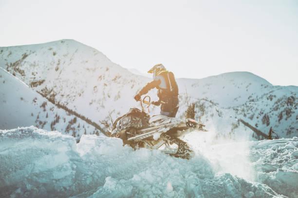 snowmobiling through a snow drift. - off road vehicle snow 4x4 driving imagens e fotografias de stock