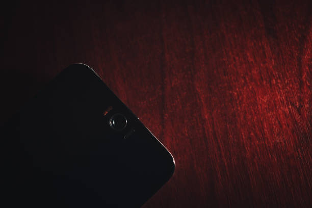istock Smart Phone on a Wooden Table Surface Background 840789150