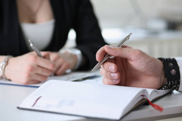 istock Group of people hold silver pen ready to make note 840789358