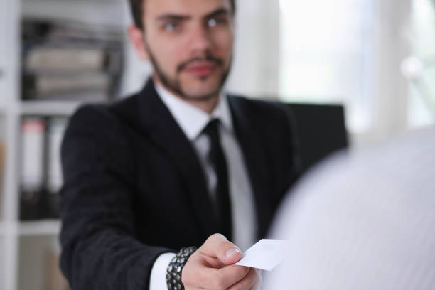istock Male hand in suit give blank calling card 840789366