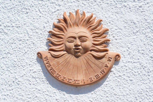 istock Sundial in clay pottery representing a sun on an empty white wall 840790846
