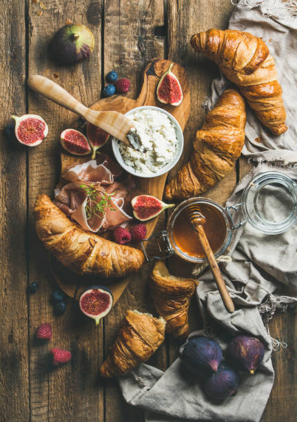 Croissants, ricotta cheese, figs, fresh berries, prosciutto and honey