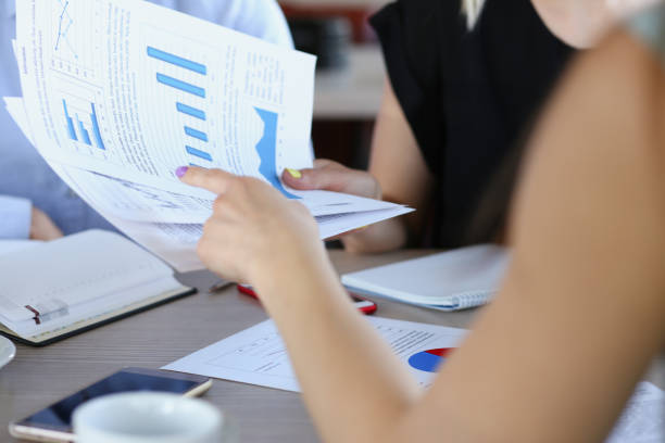 istock Female hand point finger hand to graph 840795278