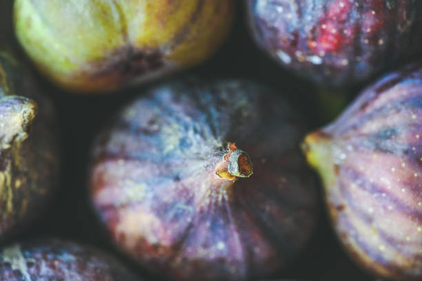 Close-up of fresh ripe purple figs, top view, horizontal composition