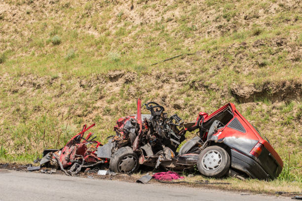 istock Unrecognizable car wreck beside a road 840803650
