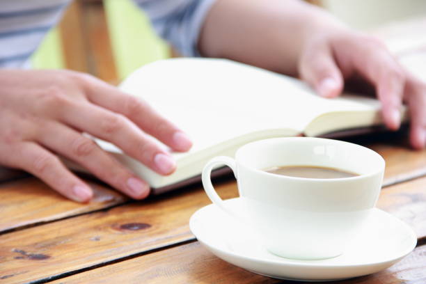 istock Woman reading book outdoors 840806672