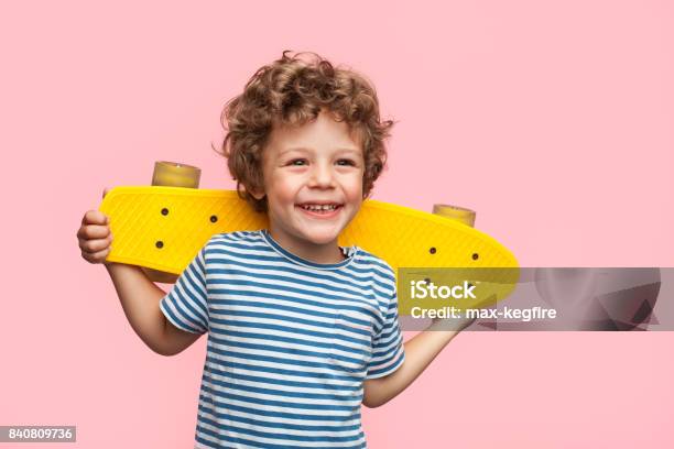 Cheerful Boy With Longboard On Pink Stock Photo - Download Image Now - Child, Boys, Portrait