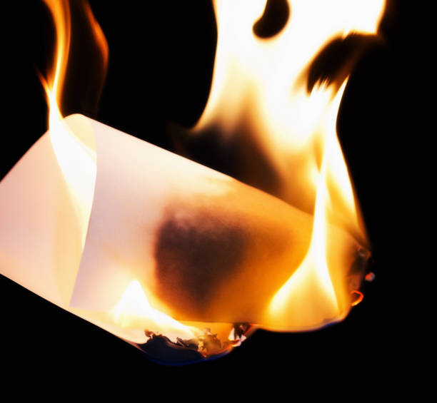 istock Brightly burning piece of paper 840813338