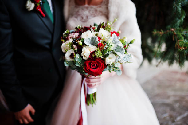 istock Lovely wedding couple standing and hugging under the fir tree. 840813934