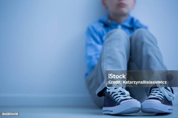 Sad Boy Sits Alone Stock Photo - Download Image Now - Child, Sadness, Anxiety