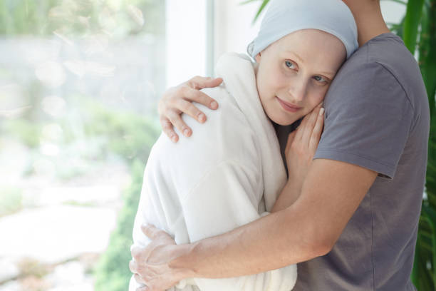 istock Husband hugging woman with cancer 840816170