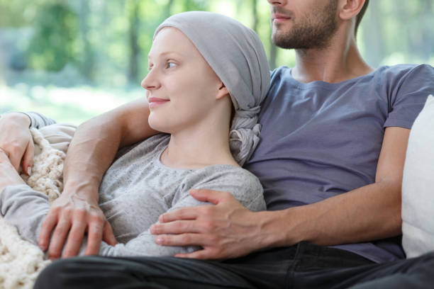 istock Husband hugging wife with cancer 840816188