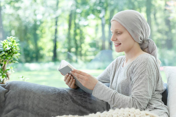 istock Woman in headscarf reading book 840816236