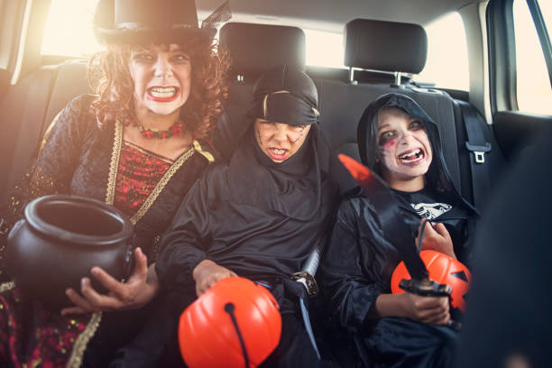 istock Dressed up kids on their way to halloween party 840818516
