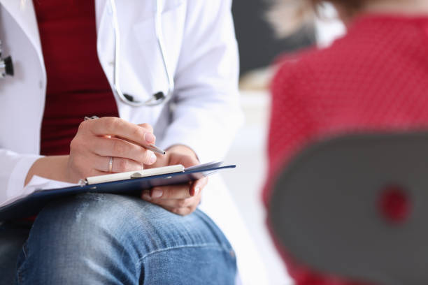 istock Little child with mother at pediatrician reception 840824854