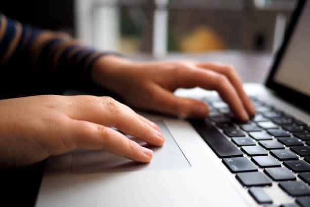 istock Child's fingers on a computer track pad 840825386