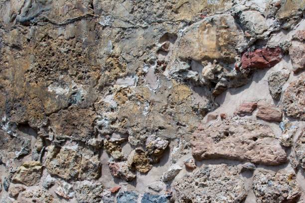 istock Ancient stone wall. Masonry of old stones and bricks. Beautiful background. 840826442