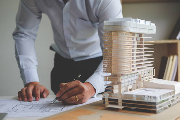 istock Hands of Engineer Working on Blueprint. Construction Concept. Engineering Tools.Vintage Tone Retro Filter Effect. Soft Focus(selective focus) 840826504