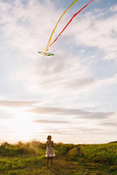 istock Girl with kite on nature 840827574