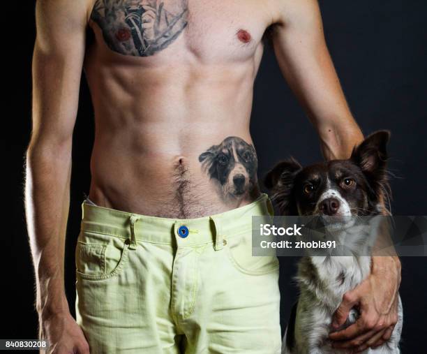 Man With Tattoos And His Dog Stock Photo - Download Image Now - Tattoo, Dog, Animal