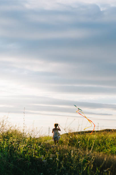 istock Anonymous girl with kite 840830386